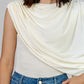 BLUSA CREMA DRAPEADA ASIMÉTRICA