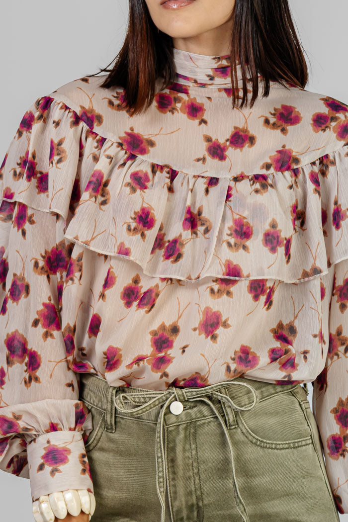 BLUSA ESTAMPADA CON VOLANTES