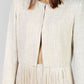 CONJUNTO BEIGE CON FLECOS