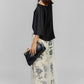 BLUSA NEGRA ASIMÉTRICA